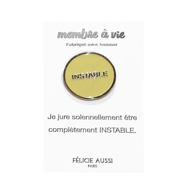 Pin's doré et blanc 